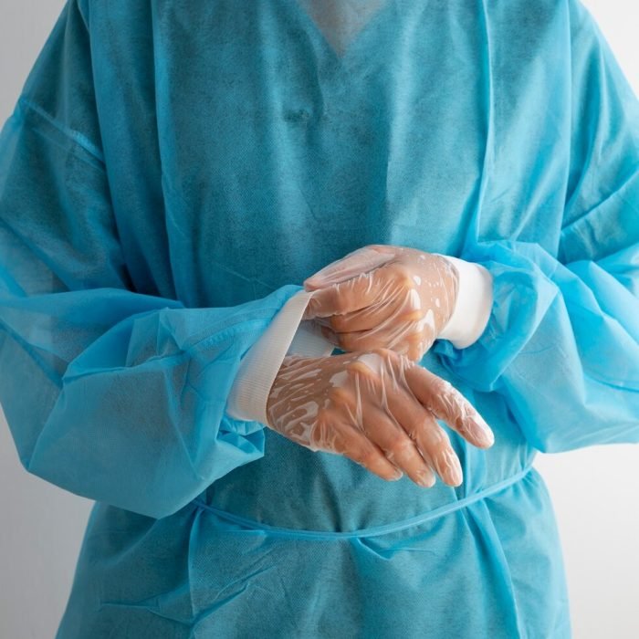 front-view-doctor-wearing-medical-gown_23-2149601774